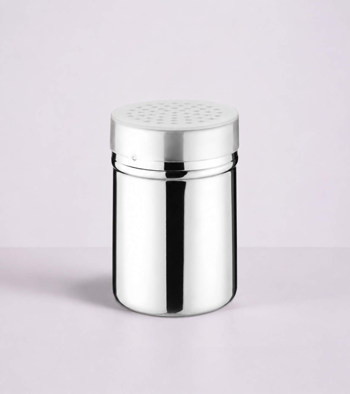 Shaker inox sur fond gris rosé